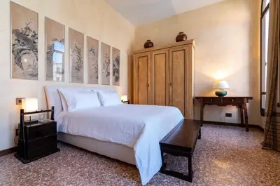 Letto o letti in una camera di Palazzo Remer - luxury apartments - by Bricola Apartments