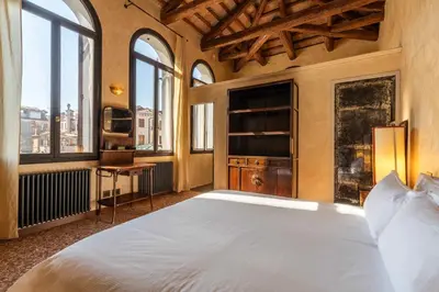 Letto o letti in una camera di Palazzo Remer - luxury apartments - by Bricola Apartments