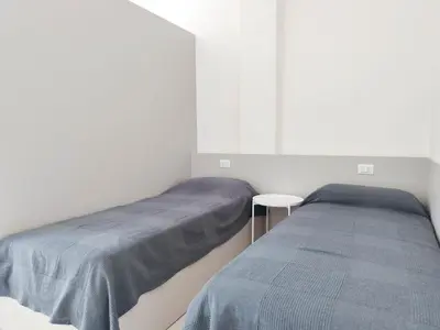 Letto o letti in una camera di Condominio Linda