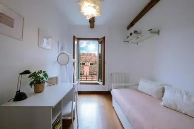 Letto o letti in una camera di BIENNALE GIARDINI CA DEL BIANCO 3 e CA DEL BIANCO 4