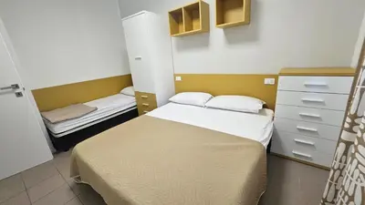 Letto o letti in una camera di Villa Veranda Quadrilocale