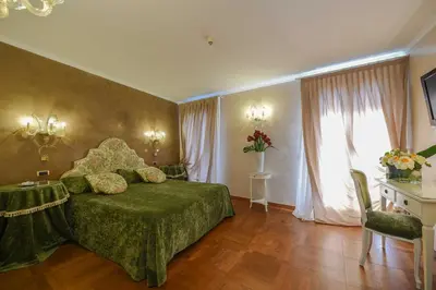 Letto o letti in una camera di Casa Savoia & Casa Jolanda