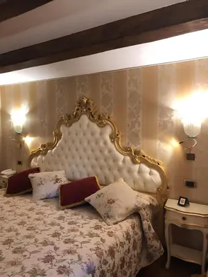 Letto o letti in una camera di Casa Savoia & Casa Jolanda