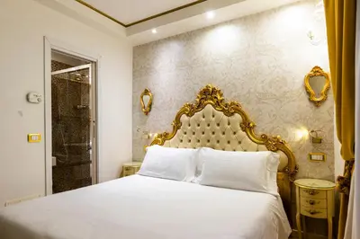 Letto o letti in una camera di Casa Savoia & Casa Jolanda