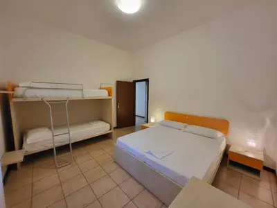 Letto o letti in una camera di Jolly family apartments