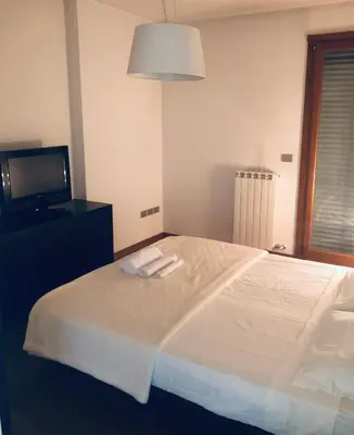 Letto o letti in una camera di Camera privata con bagno su appartamento condiviso