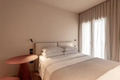 Letto o letti in una camera di Alma Suites