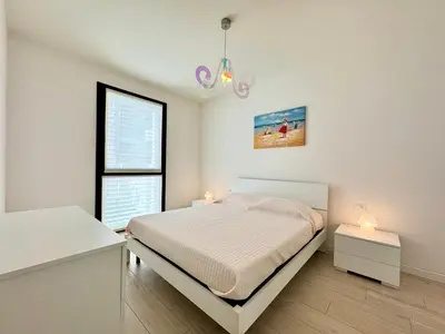 Letto o letti in una camera di Enia - Carraro Immobiliare - Family Apartments