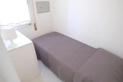 Letto o letti in una camera di Cansiglio Apartments