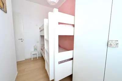 Letto o letti in una camera di Villaggio dei Pellicani Apartments