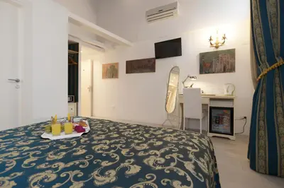 Letto o letti in una camera di Al Mascaron Ridente