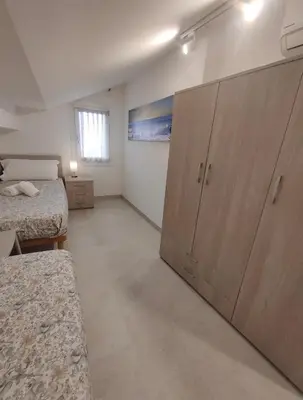Letto o letti in una camera di Novella Apartment