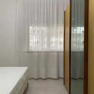 Letto o letti in una camera di [Piazza_Drago_Apartment] Pool, Garden & Free Park