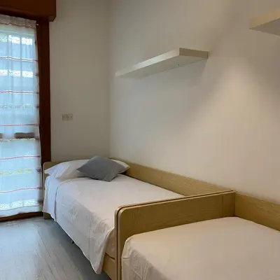 Letto o letti in una camera di [Piazza_Drago_Apartment] Pool, Garden & Free Park