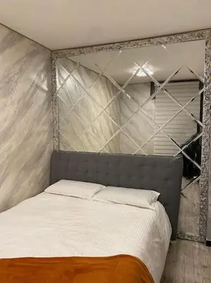 Letto o letti in una camera di Appartamento SOLO 1 camera da letto soggiorno con angolo cottura completo e bagno Tutto ad uso esclusivo max 2 persone
