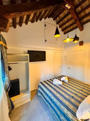 Letto o letti in una camera di Piccolo Paradiso