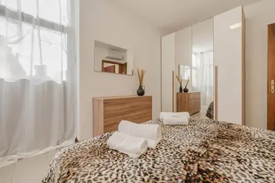 Letto o letti in una camera di Unico Apt 4, 6 ospiti, parcheggio gratis, 10 minuti da Venezia