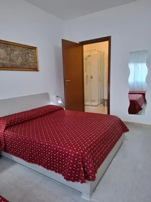 Letto o letti in una camera di LUCAZIONE TURISTICa