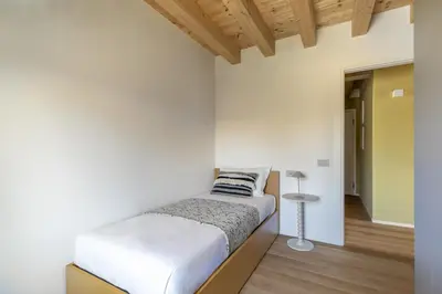 Letto o letti in una camera di Molino4 by WelcHome
