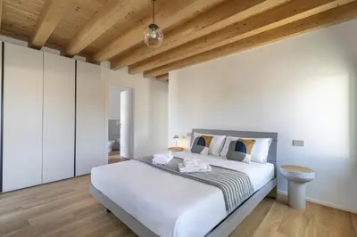 Letto o letti in una camera di Molino4 by WelcHome
