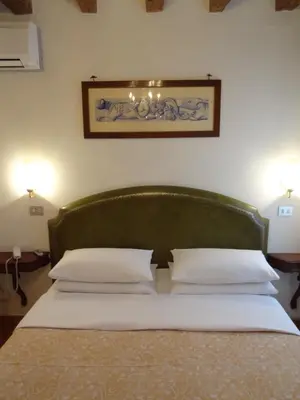 Letto o letti in una camera di Hotel Minerva & Nettuno di Venezia