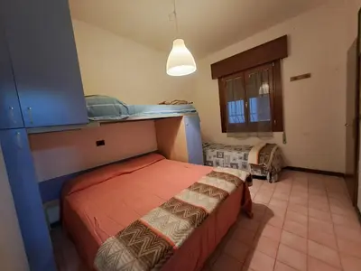 Letto o letti in una camera di Villa Monica - Seasons Real Estate - Lido di Jesolo