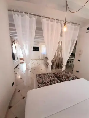 Letto o letti in una camera di Casa Airoldi Incantevole appartamento in laguna