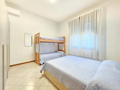 Letto o letti in una camera di Voltacinque Family Apartment