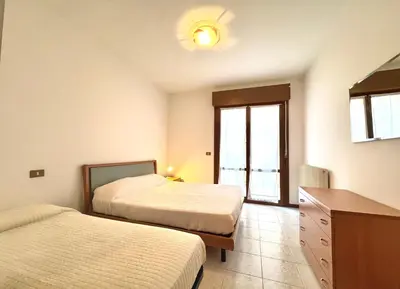 Letto o letti in una camera di Carnelos - Carraro Immobiliare - Family Apartments