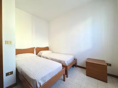 Letto o letti in una camera di Carnelos - Carraro Immobiliare - Family Apartments