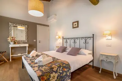Letto o letti in una camera di Casa dei Fiori