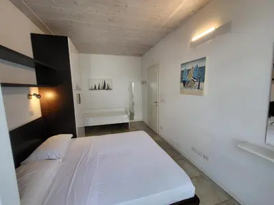 Letto o letti in una camera di Residence Mediterranee Family Apartments