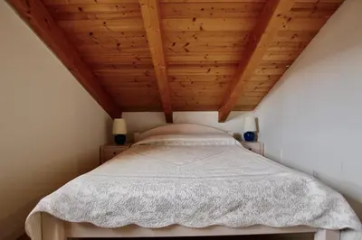 Letto o letti in una camera di Condominio Oderzo - Home Immobiliare