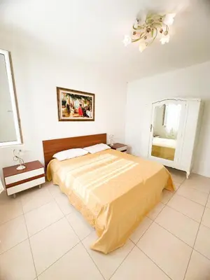 Letto o letti in una camera di VILLA RENZO- PARCHEGGIO E GIARDINO PRIVATI a pochi passi dal mare