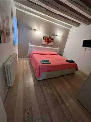 Letto o letti in una camera di Rialto Rooms very central