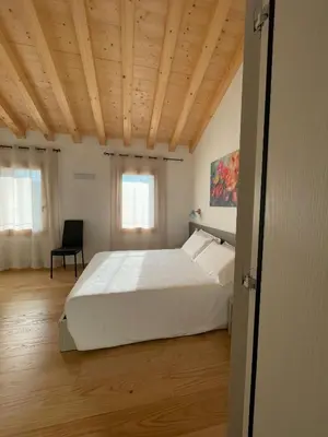 Letto o letti in una camera di Dalla Afra Agrialloggi