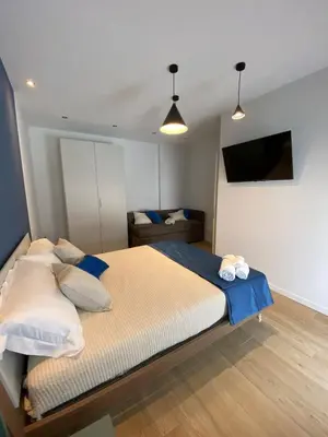Letto o letti in una camera di Alloggi Celly Appartamento con aria condizionata e terrazzo