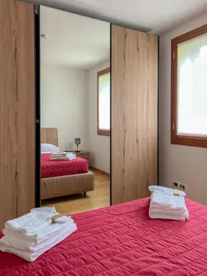 Letto o letti in una camera di Villa Cattarin