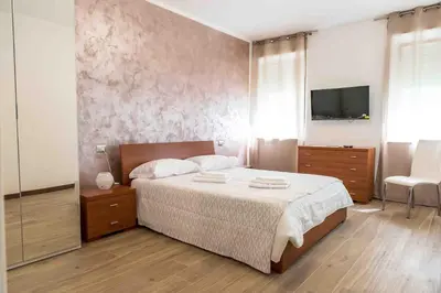 Letto o letti in una camera di Da Nat Apartment