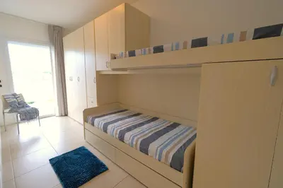 Letto o letti in una camera di Residence Laguna Park Piazza Brescia