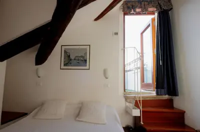Letto o letti in una camera di Hotel ai do Mori