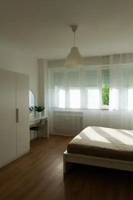 Letto o letti in una camera di Corso 73 - Accogliente appartamento a Mestre-VE