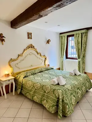 Letto o letti in una camera di Dimora Veneziana Rooms