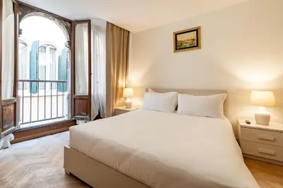 Letto o letti in una camera di Torre dell'orologio Apartment by Bricola Apartments