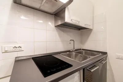 Cucina o angolo cottura di Torre dell'orologio Apartment by Bricola Apartments