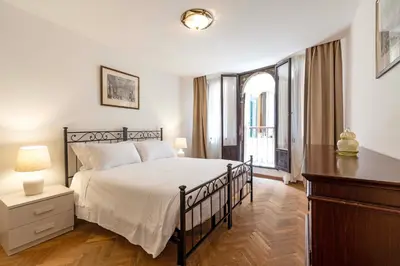 Letto o letti in una camera di Torre dell'orologio Apartment by Bricola Apartments