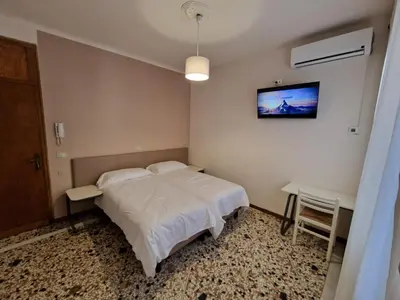 Letto o letti in una camera di Albergo D'Ambros - Casa Belfiore Group