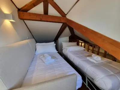 Letto o letti in una camera di Marzia Home