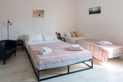 Letto o letti in una camera di The Pearl of the Lagoon