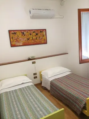 Letto o letti in una camera di Locanda Trattoria Caffè Cavour